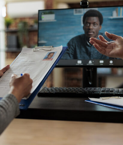 Manager women working at hiring application discussing curriculum vitae with remote recruiter during online videocall meeting conference in startup office. Teleconference call on computer screen